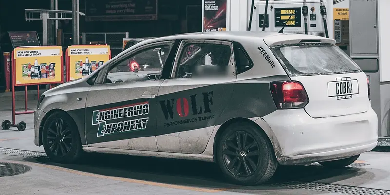 Engineering Exponent's liveried Polo GT race car, side on, at night